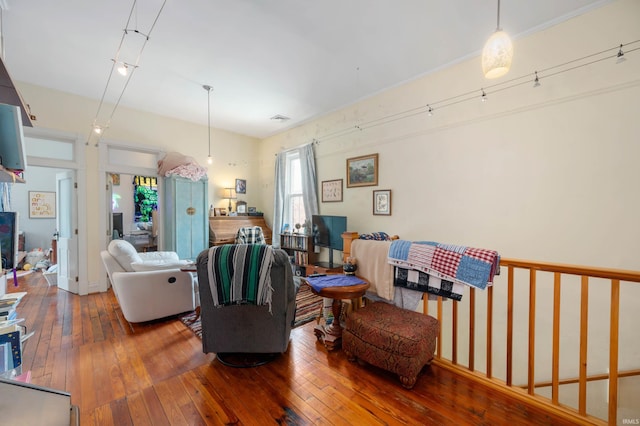 living room featuring visible vents and wood-type flooring