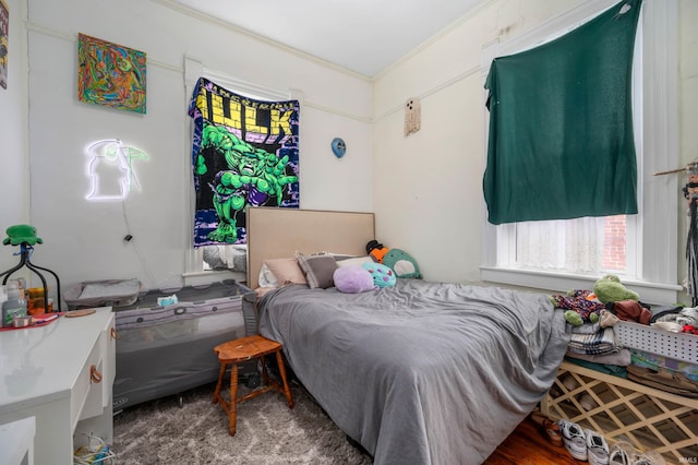 bedroom featuring crown molding