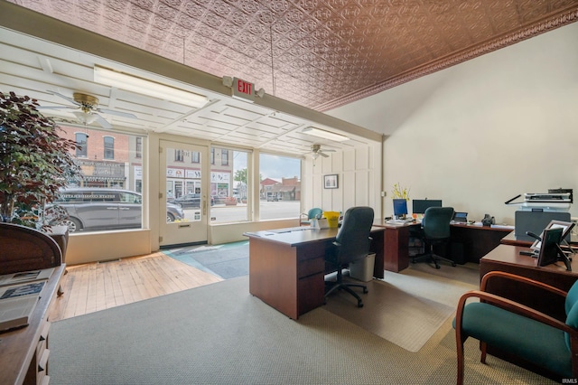 office featuring hardwood / wood-style flooring, ceiling fan, and an ornate ceiling