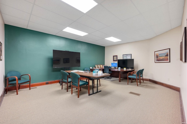 interior space with visible vents, baseboards, and a paneled ceiling