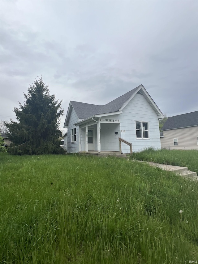 712 E Water St, Portland, IN 47371 - view of side of property featuring a shingled roof