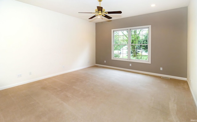 unfurnished room featuring baseboards, recessed lighting, ceiling fan, and light colored carpet