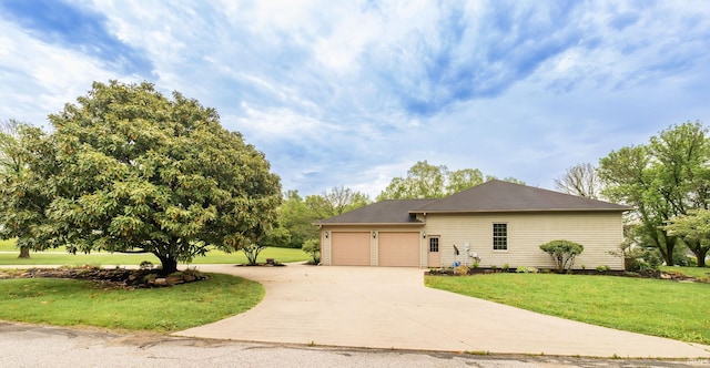 ranch-style house featuring a front lawn, a garage, and concrete driveway