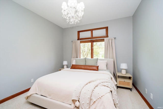 4052 Diamond Row, Greenwood, IN 46143 - bedroom featuring light colored carpet, baseboards, and a notable chandelier