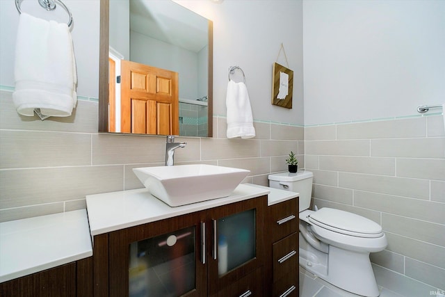 4052 Diamond Row, Greenwood, IN 46143 - bathroom featuring toilet, tile walls, and vanity