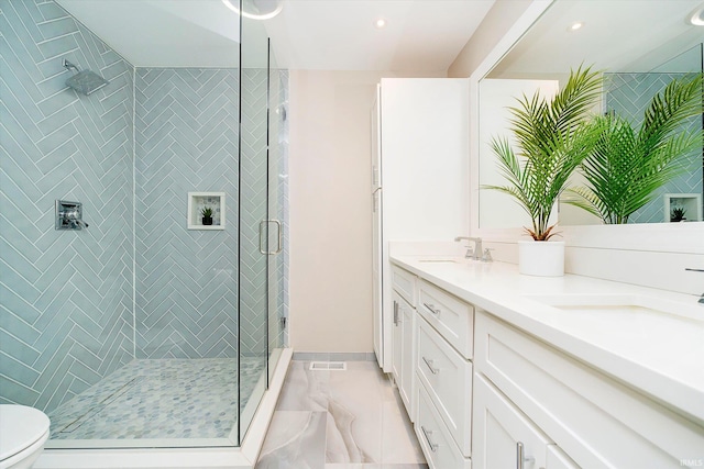 4052 Diamond Row, Greenwood, IN 46143 - full bath featuring a sink, toilet, marble finish floor, a stall shower, and double vanity