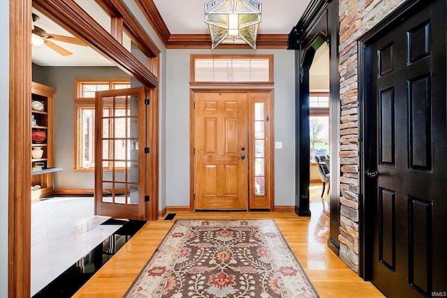 4052 Diamond Row, Greenwood, IN 46143 - entryway featuring ornamental molding, light wood-type flooring, baseboards, and ceiling fan