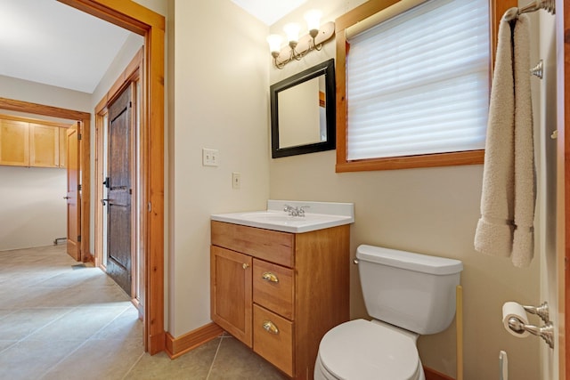 bathroom with vanity, toilet, and tile patterned floors