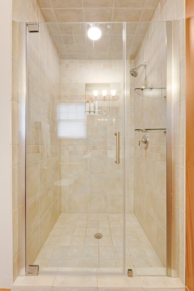 full bathroom featuring a stall shower