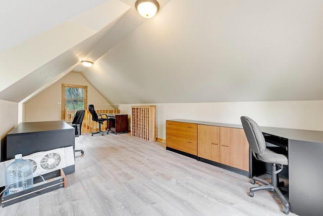 office space with light wood finished floors and lofted ceiling