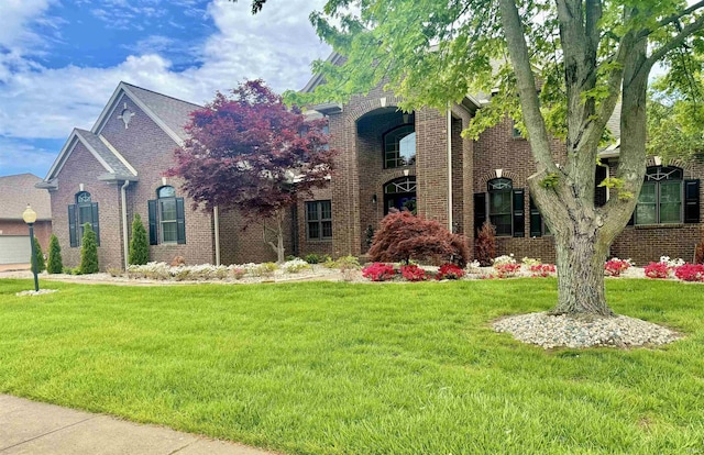 2122 Lakes Edge Dr, Newburgh, IN 47630 - view of front of house with brick siding and a front lawn