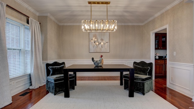 2122 Lakes Edge Dr, Newburgh, IN 47630 - dining space featuring a chandelier, wood finished floors, visible vents, and ornamental molding