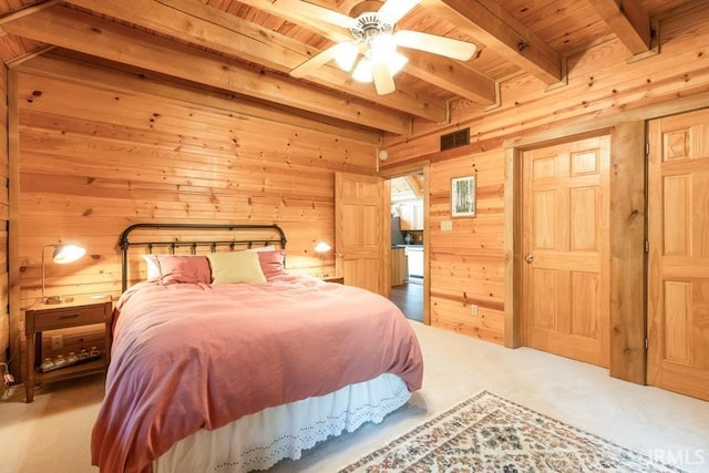6705 S Shields Ridge Rd, Bloomington, IN 47401 - carpeted bedroom with wooden walls, wood ceiling, visible vents, and beam ceiling