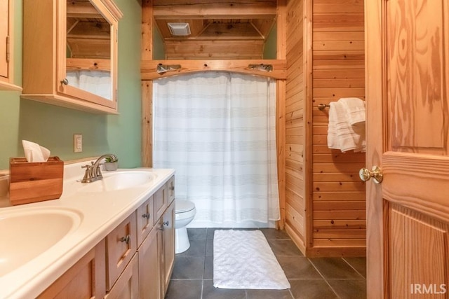 6705 S Shields Ridge Rd, Bloomington, IN 47401 - full bathroom featuring toilet, wood walls, and a sink