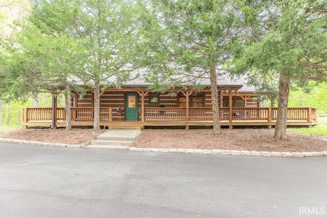 6705 S Shields Ridge Rd, Bloomington, IN 47401 - log-style house with a porch