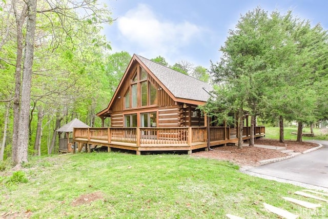 6705 S Shields Ridge Rd, Bloomington, IN 47401 - back of property with a yard, log siding, a deck, and a shingled roof