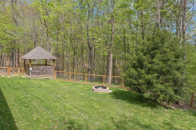 6705 S Shields Ridge Rd, Bloomington, IN 47401 - view of yard featuring a fire pit, a gazebo, and a fenced backyard