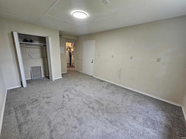 unfurnished bedroom with carpet flooring and baseboards