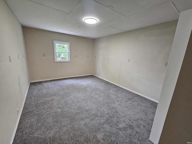 empty room with baseboards and carpet floors
