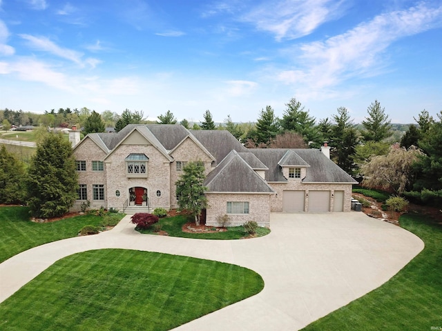 13 Rolling Ridge Ct, Jasper, IN 47546 - french country inspired facade with a chimney, driveway, brick siding, a garage, and a front yard