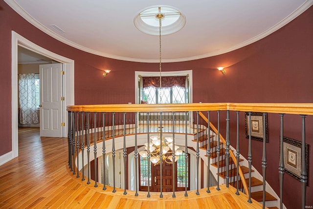 13 Rolling Ridge Ct, Jasper, IN 47546 - stairway featuring ornamental molding, a chandelier, baseboards, and hardwood / wood-style floors