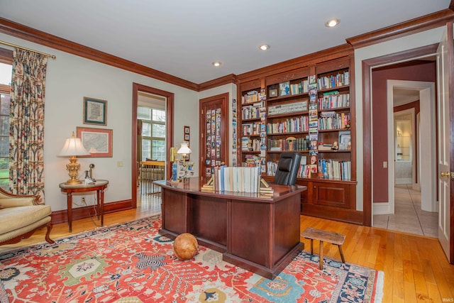 13 Rolling Ridge Ct, Jasper, IN 47546 - home office with light wood-style flooring, baseboards, built in shelves, ornamental molding, and recessed lighting