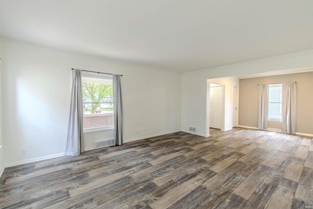 306 S Main St, Topeka, IN 46571 - spare room with visible vents, wood finished floors, and a healthy amount of sunlight