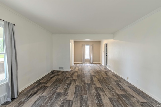 306 S Main St, Topeka, IN 46571 - unfurnished room with crown molding, visible vents, wood finished floors, and baseboards