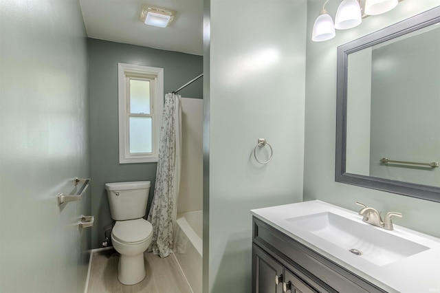 306 S Main St, Topeka, IN 46571 - full bathroom featuring toilet, vanity, and shower / bath combo