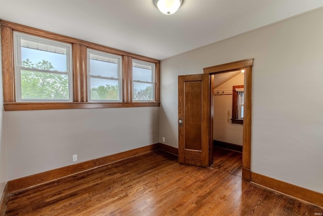 306 S Main St, Topeka, IN 46571 - unfurnished bedroom with baseboards and wood finished floors