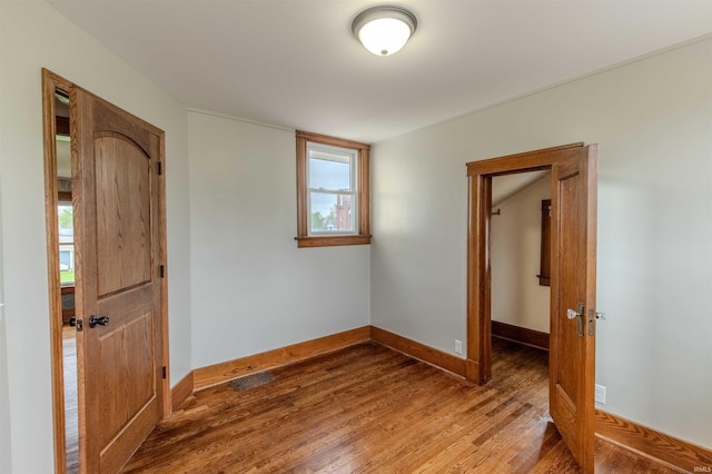 306 S Main St, Topeka, IN 46571 - interior space featuring baseboards, visible vents, and wood finished floors