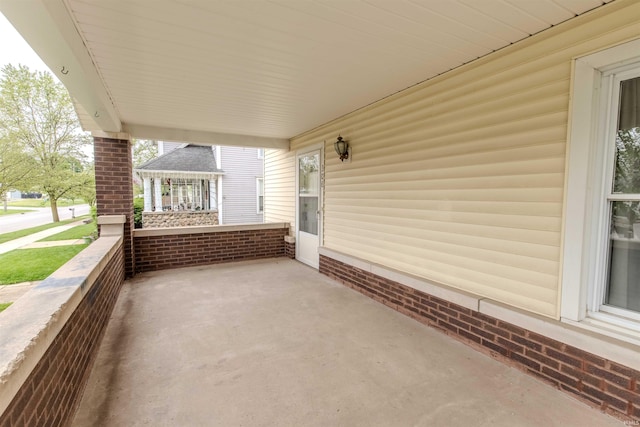 306 S Main St, Topeka, IN 46571 - view of patio featuring covered porch