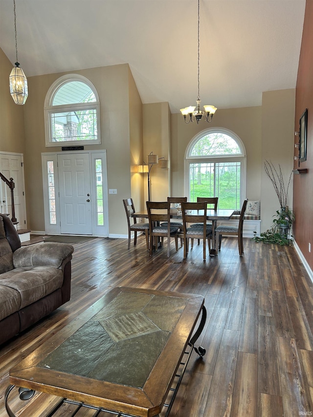 2034 County Road 68, Auburn, IN 46706 - living room with high vaulted ceiling, a chandelier, dark wood-type flooring, and baseboards