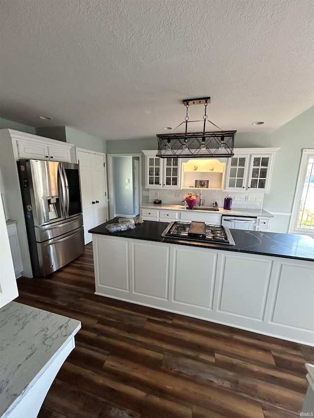 2034 County Road 68, Auburn, IN 46706 - kitchen with stainless steel appliances, dark wood-style floors, a textured ceiling, white cabinets, and glass insert cabinets