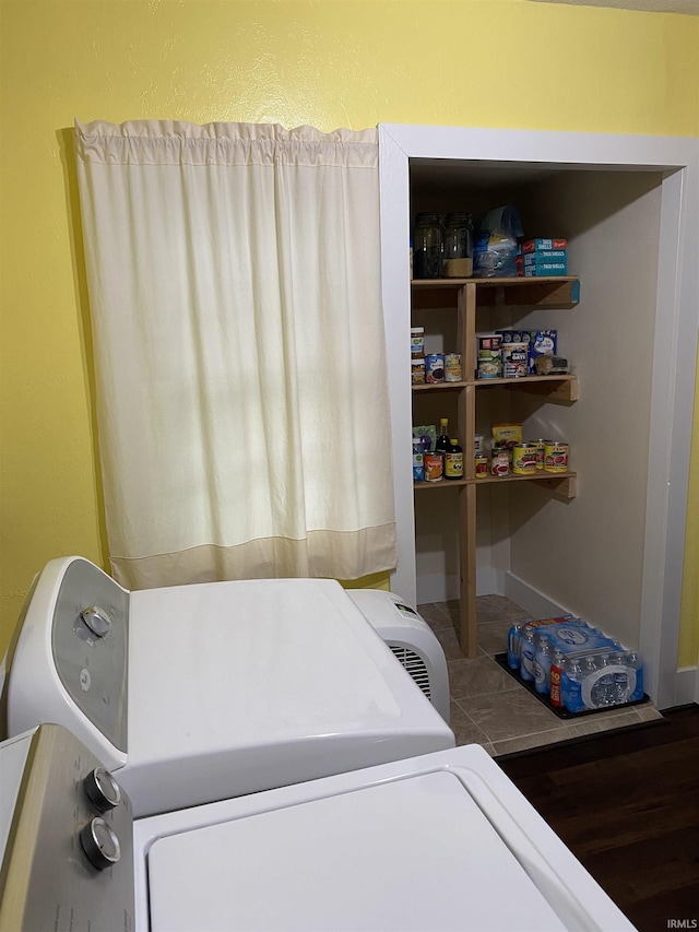 washroom with laundry area and washer and dryer