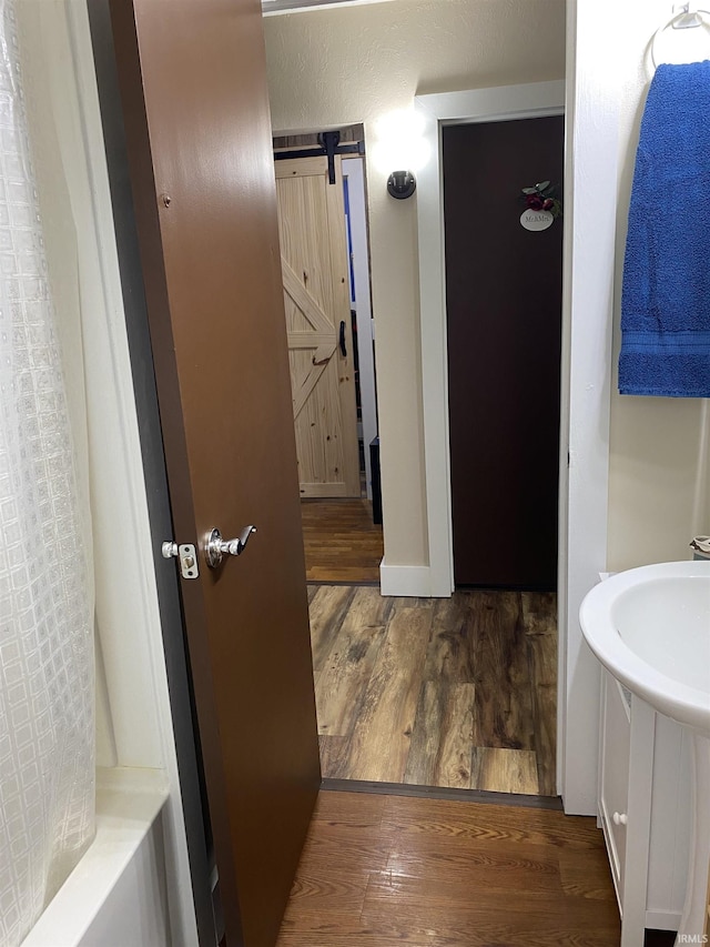 bathroom featuring wood finished floors