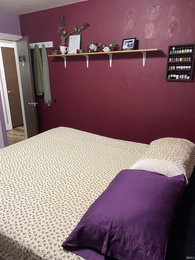 bedroom with wood finished floors