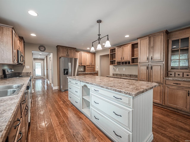 kitchen featuring open shelves, stainless steel appliances, a kitchen island, and dark wood-type flooring