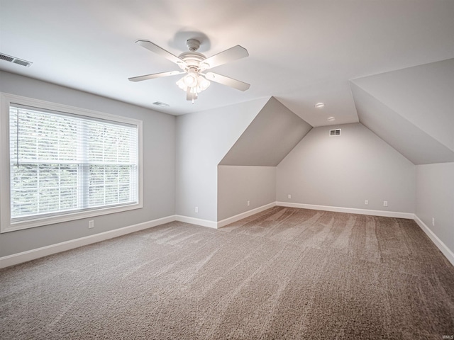 bonus room with light carpet, baseboards, and visible vents