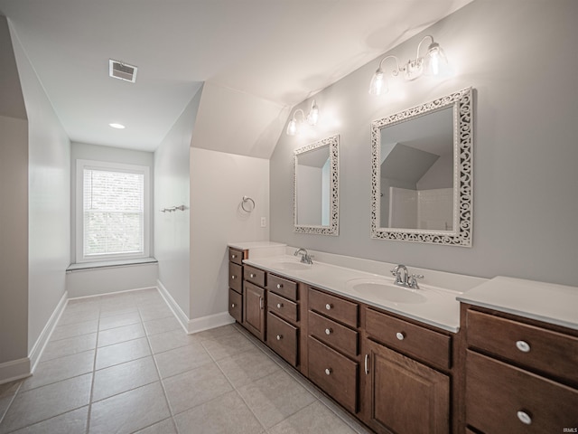 bathroom with visible vents, baseboards, and a sink