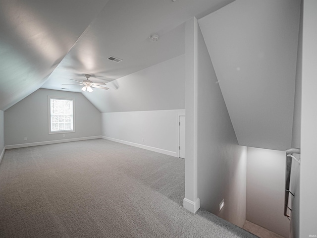 bonus room with visible vents, vaulted ceiling, ceiling fan, carpet floors, and baseboards