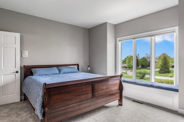 carpeted bedroom with visible vents