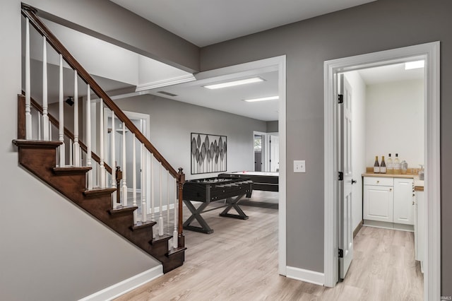 interior space with baseboards and wood finished floors