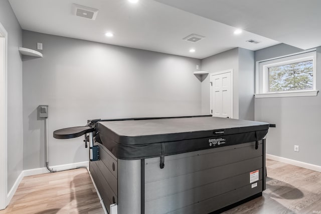 rec room featuring baseboards, recessed lighting, light wood-style floors, and visible vents