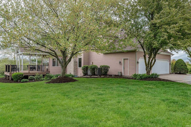 view of front of house with a front lawn, concrete driveway, a deck, and a garage
