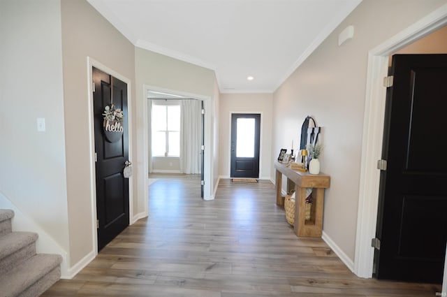 6357 Spirea Ct, West Lafayette, IN 47906 - entrance foyer with wood finished floors, recessed lighting, stairway, crown molding, and baseboards