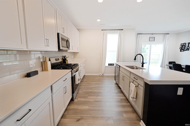6357 Spirea Ct, West Lafayette, IN 47906 - kitchen featuring stainless steel appliances, recessed lighting, a sink, decorative backsplash, and light countertops