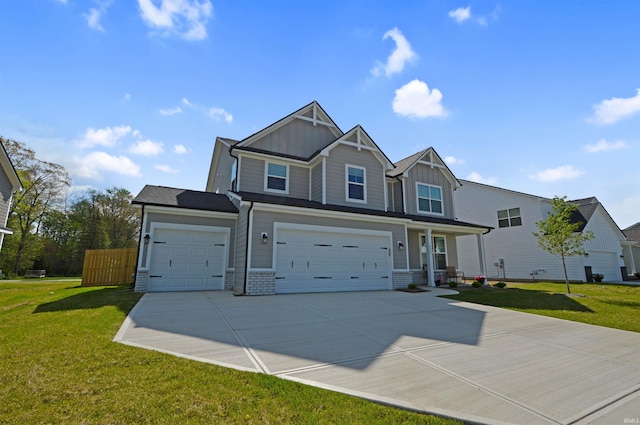 6357 Spirea Ct, West Lafayette, IN 47906 - craftsman house featuring driveway, an attached garage, a front lawn, and board and batten siding