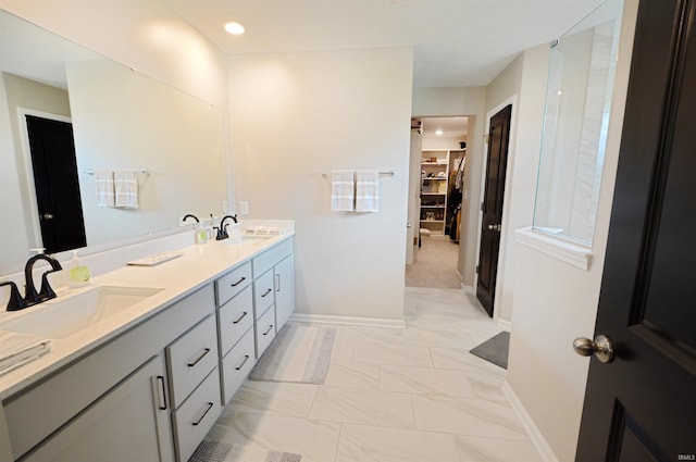 6357 Spirea Ct, West Lafayette, IN 47906 - full bath with baseboards, double vanity, a sink, and a walk in closet