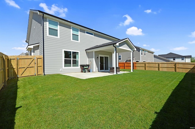 6357 Spirea Ct, West Lafayette, IN 47906 - back of property featuring a lawn, a patio area, and a fenced backyard
